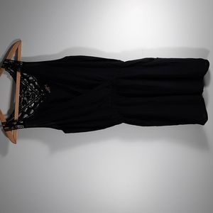 NWOT black sleeveless romper SZ M.